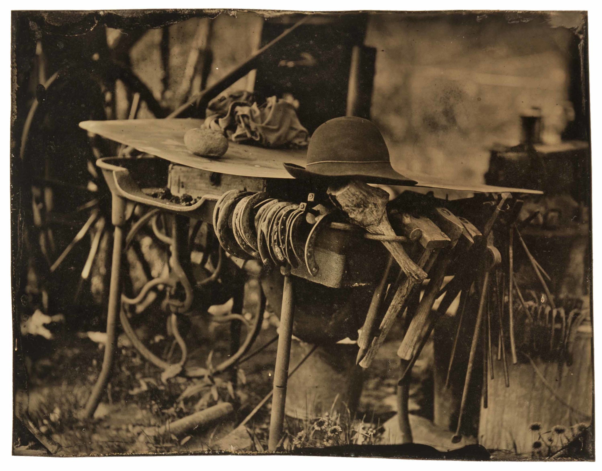 
		                					John Coffer		                																	
																											<i>My Hat on My Forge,</i>  
																																								2005, 
																																								tintype, 
																																								4 x 5 1/4 inches 
																								
		                				