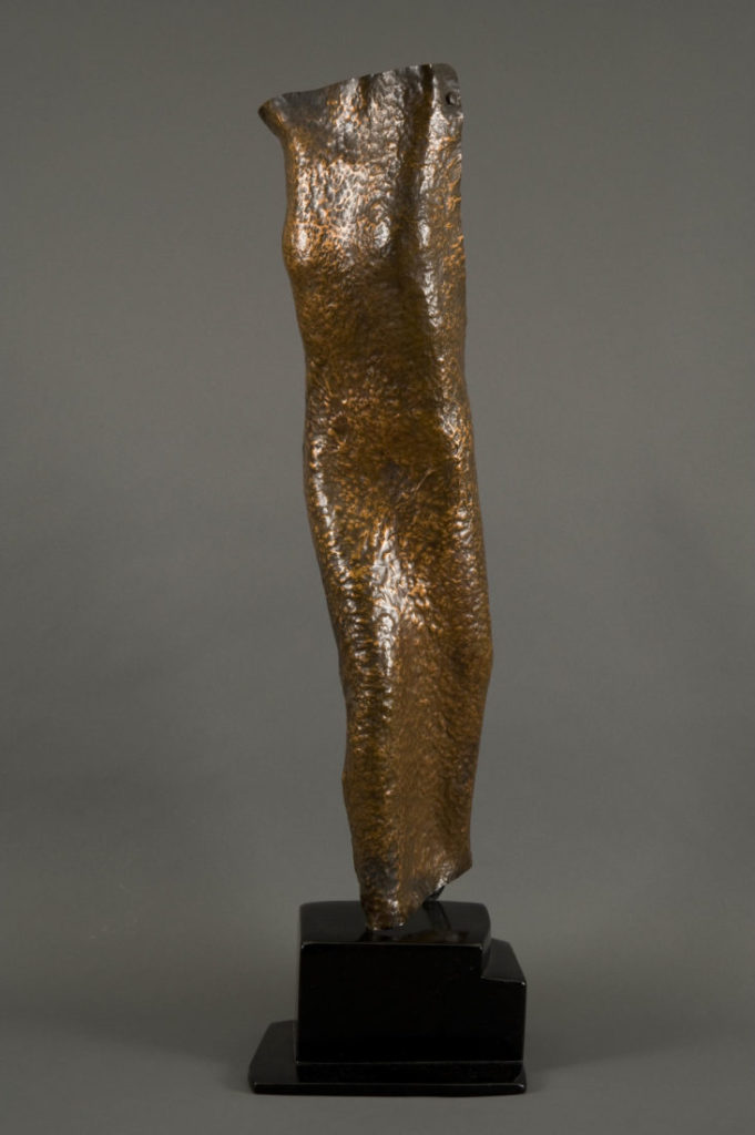 hammered copper sculpture of female figure