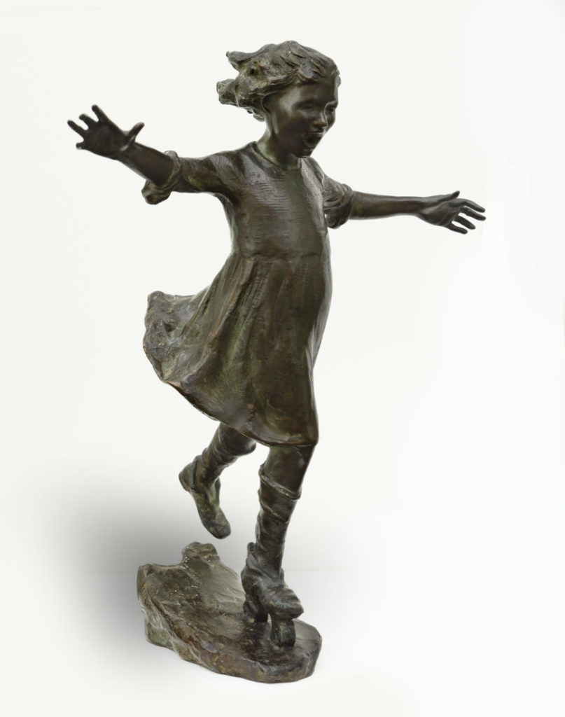 bronze sculpture of girl ice skating
