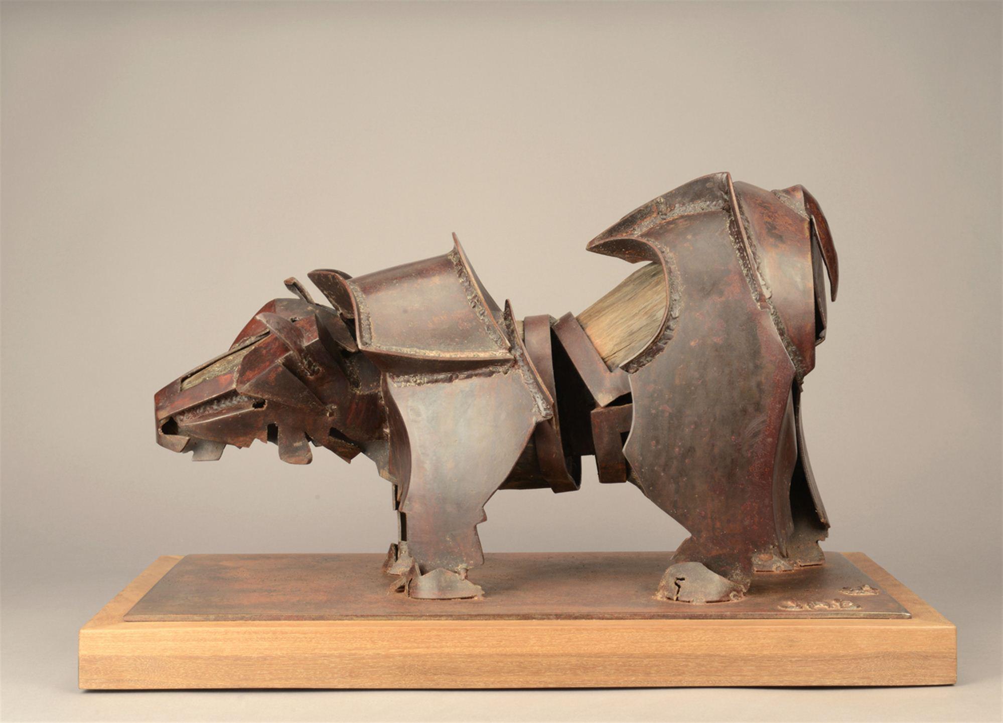
		                					James Burnes		                																	
																											<i>Bear Study,</i>  
																																																					steel and wood, 
																																								13 1/2 x 22 x 10 1/2 inches 
																								
		                				
