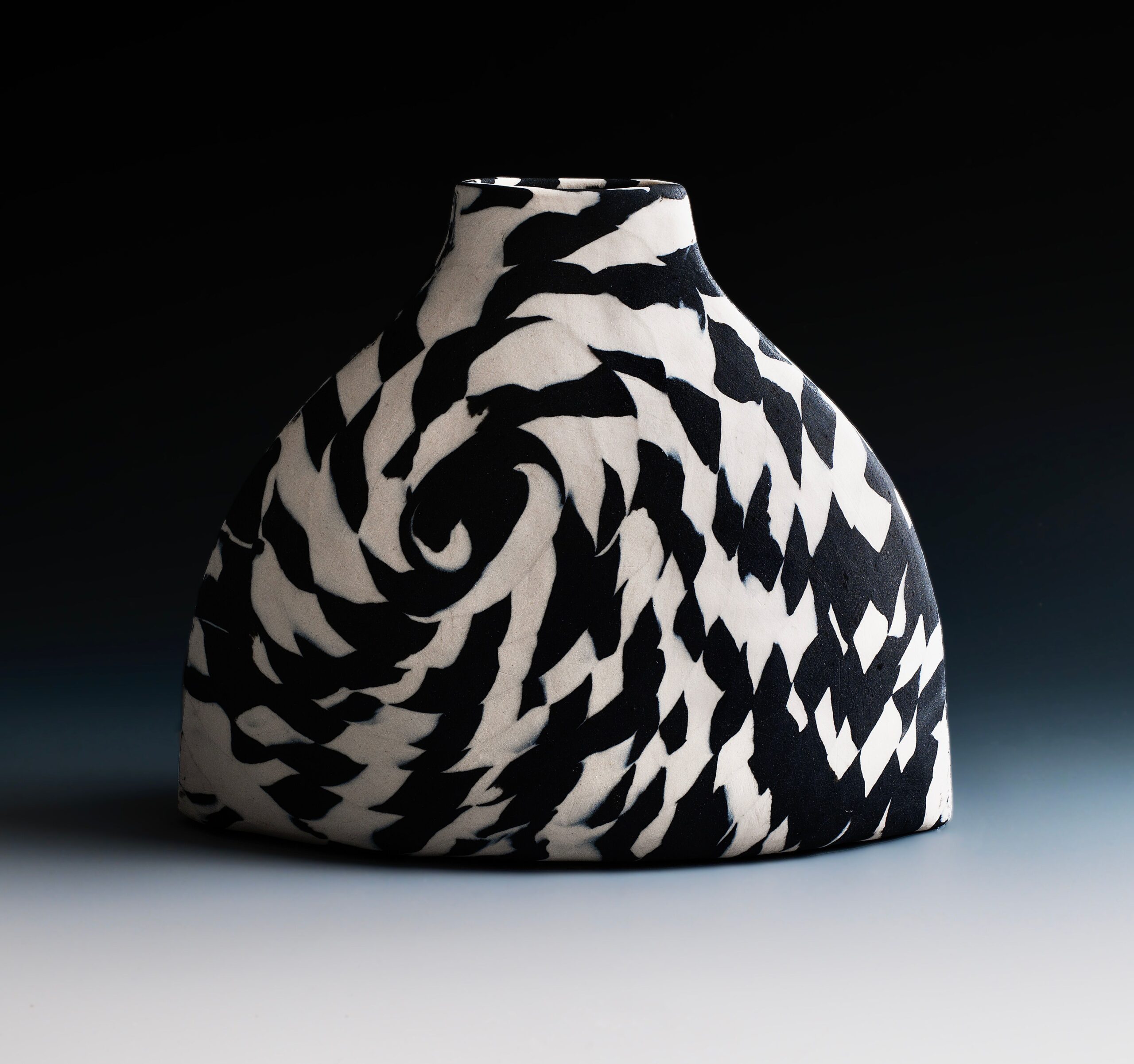 
							

									Lorraine Shemesh									Black & White Wide Twist Nerikomi Bottle II 2021									porcelain<br />
8 1/2 x 10 1/4 x 3 1/4 inches									


							