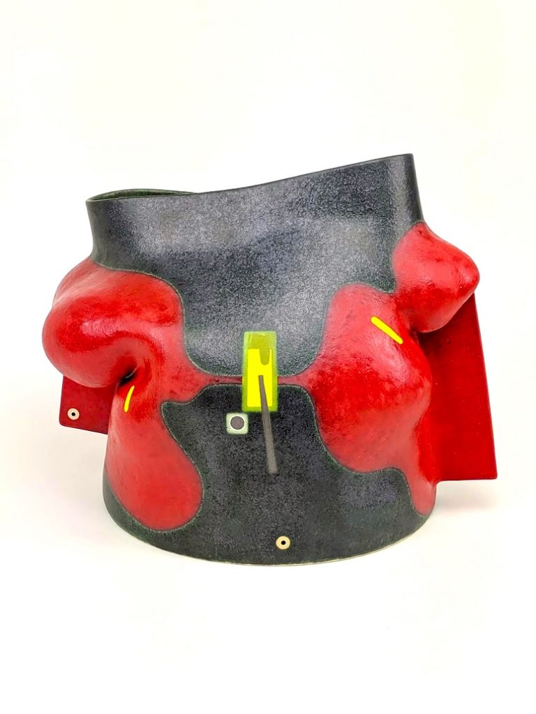 black, red and yellow stoneware sculpture by Jose Sierra