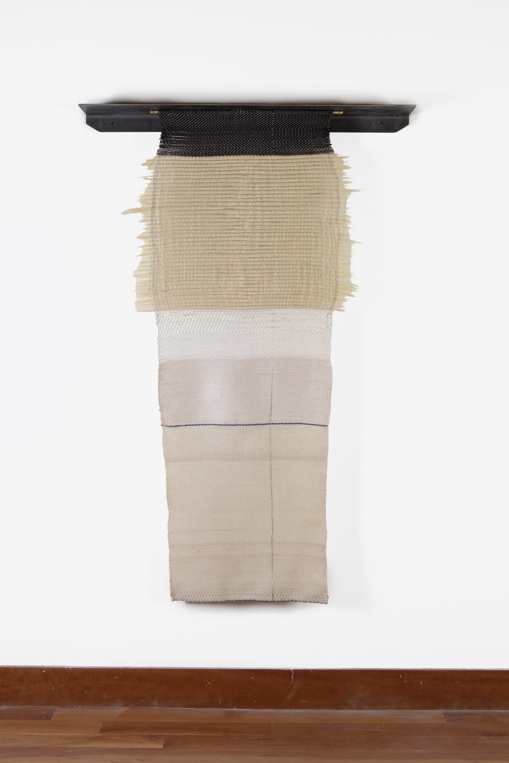 
							

									Elizabeth Hohimer									The Center Holds 2023									west Texas cotton, agave fiber, churro wool, ribbon, linen, steel<br />
72 x 48 x 7 inches									


							