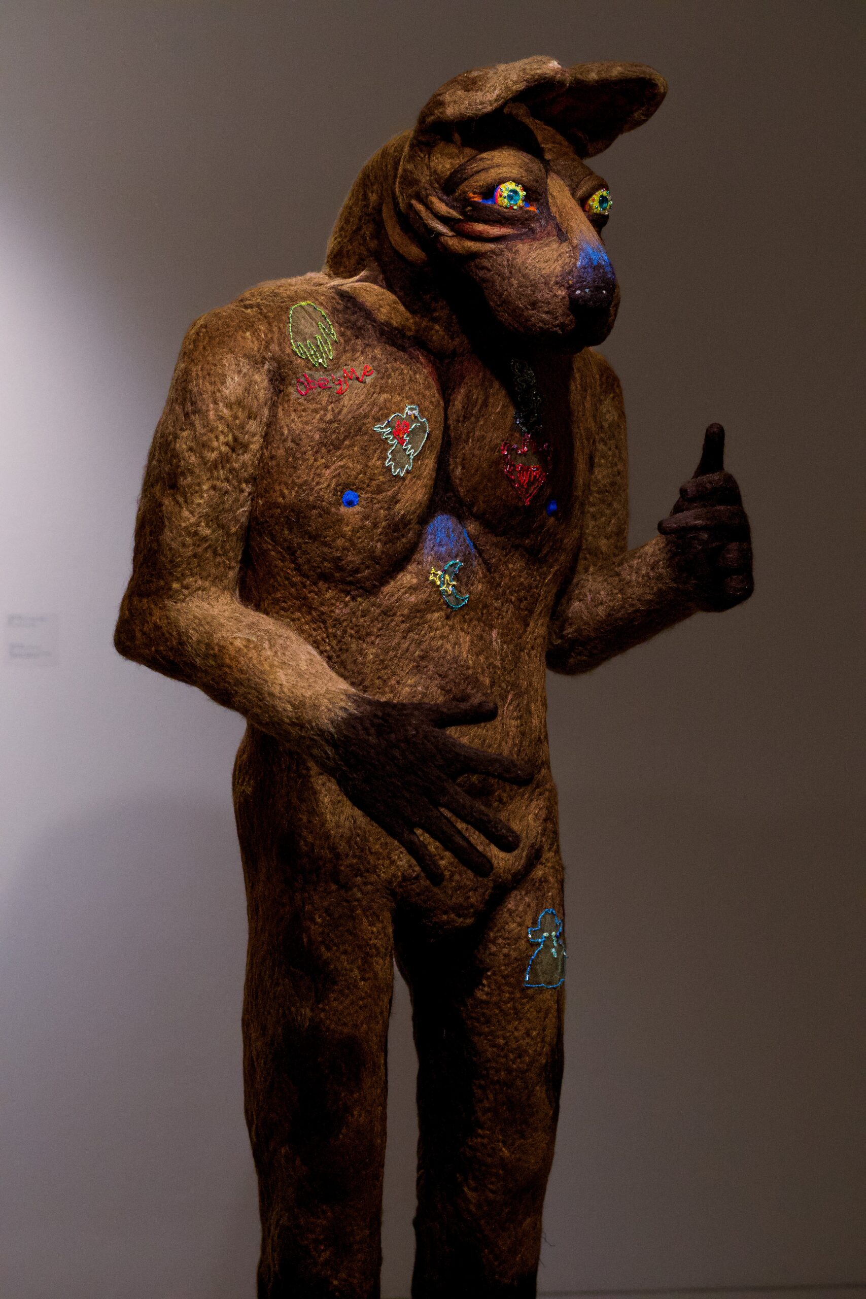 
							

									Angelica Raquel									Cursed Spirit of Downtown Laredo 2023									Needle felted wool and polyfiber, glass beads, embroidered imagery, sequins<br />
72 x 29 x 26 inches									


							