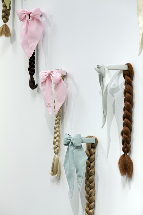 
							

									Angela Ellsworth									Lady Ties for a Line Dance (detail) 2011									Linen, thread, brass, and artificial hair<br />
96 x 84 inches (installed dimensions)									


							