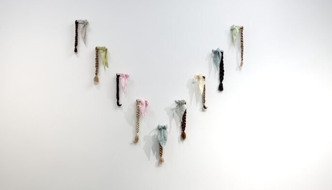 
							

									Angela Ellsworth									Lady Ties for a Line Dance 2011									Linen, thread, brass, and artificial hair<br />
96 x 84 inches (installed dimensions)									


							